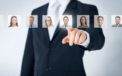 human resources, career management, recruitment and success concept - man in suit pointing to of many business people portraits